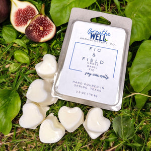 Fig & Field Soy Wax Melts in a plastic clamshell container with earthy scents of fresh grass, fig, and basil for a calming ambiance. - Breathe Well Aromatherapy