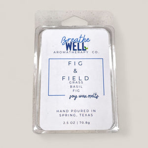 Fig & Field Soy Wax Melts in a plastic clamshell container with earthy scents of fresh grass, fig, and basil for a calming ambiance. - Breathe Well Aromatherapy
