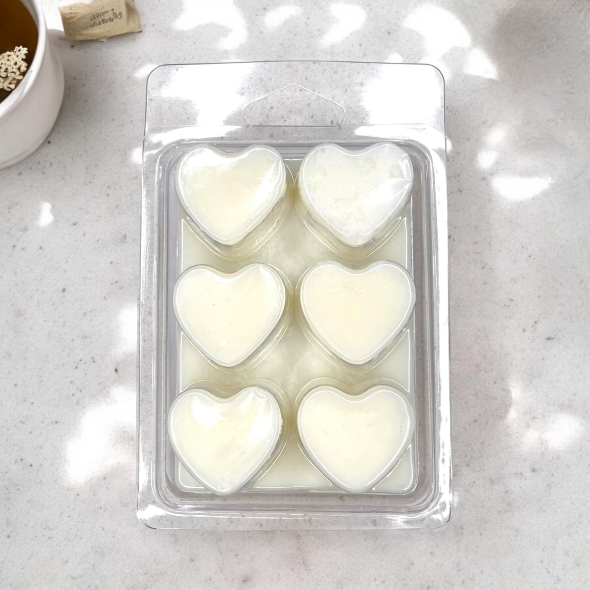 Spiced Chai Tea Soy Wax Melts heart shaped in clamshell packaging with organic chai tea and allspice - Breathe Well Aromatherapy