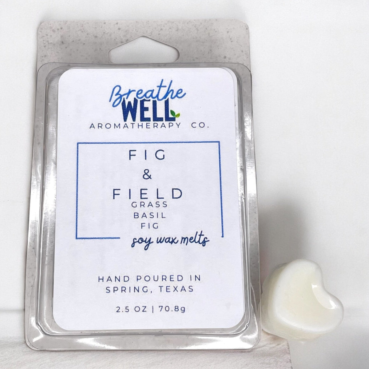 Fig & Field Soy Wax Melts in a plastic clamshell container with earthy scents of fresh grass, fig, and basil for a calming ambiance. - Breathe Well Aromatherapy